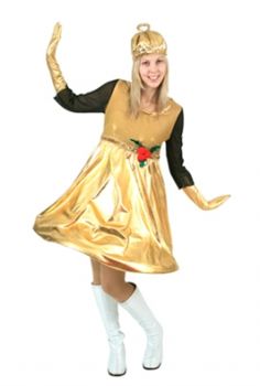 a woman in a gold dress and white boots is posing for the camera with her arms outstretched