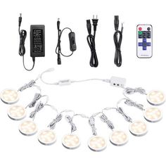 a bunch of lights that are on some kind of corded light set up with remote controls