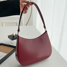 SPECIFICATIONSBrand Name: BOBAGHandbags Type: Shoulder BagsMain Material: PULining Material: NoneShape: BoxPlace Of Origin: HE BEI ProvincePlace Of Origin: HE BEI ?ProvinceOrigin: Mainland ChinaHardness: SOFTPattern Type: SolidInterior: No PocketExterior: Solid BagOccasion: VersatileClosure Type: haspGender: WOMENStyle: fashionModel Number: shoudler bagNumber of Handles/Straps: SingleChoice: yessemi_Choice: yes Burgundy Bags With Leather Handles For On-the-go, High-end Red Shoulder Bag With Double Handle, Luxury Bucket-shaped Hobo Bag With Detachable Handle, Burgundy Leather Shoulder Bag With Silver-tone Hardware, Modern Red Shoulder Bag With Gold-tone Hardware, Sweater Bags, Retro Purse, Luxury Designer Handbags, Leather Boot Shoes