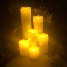 lit candles in the dark on a table