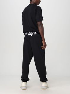 These Palm Angels trousers feature an elasticated waist and relaxed fit. Palm Angels Pants, Angel Man, Italian Fashion Designers, Pants For Men, Palm Angels, Italian Fashion, Black Tshirt, Black Pants, Mens Pants