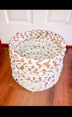 Environmentally friendly handmade basket made of 100% recycled plastic bags. This one-of-a-kind storage bin organizes your blankets, towels, toys and other items giving you a unique, crafty look in your living room, bedroom, or bathroom.  Creative way to upcycle plastic and reduce waste in the landfills. Each basket is made based on plastic bag availability, making each one unique with a variety of colors. Each basket is sanitized before shipment.  Brown and white basket  Dimensions: 13 inches w Basket Braid, Upcycle Plastic, Storage Bins Organization, Recycled Plastic Bags, White Basket, White Baskets, Small Basket, Handmade Baskets, Reduce Waste