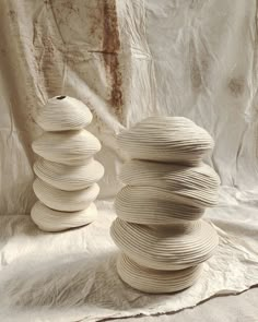 stacks of white plates sitting next to each other on top of a sheet of paper