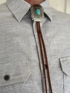 For the Vintage Western aficionado, our awesome Silver & Turquoise Square Concho Bolo Tie is a real winner! Yellowstone's Rip Wheeler, I'm pretty sure you need this gorgeous Bolo Tie, after commenting on Malcom Beck's erroneous cinch job! Our Silver & Turquoise Square Concho Bolo Tie is a Southwestern Style favorite for man or woman. A great gift for any Cowboy, Cowgirl, Bolo Tie, Rodeo, Yellowstone TV, or 1883 Series Lovers. Though Bolo ties are no longer limited to Western world, they'll set o Western Style Turquoise Bolo Tie For Western-themed Events, Southwestern Turquoise Bolo Tie For Western-themed Events, Southwestern Turquoise Bolo Ties For Western-themed Events, Southwestern Concho Bolo Tie For Ranch, Southwestern Bolo Ties With Concho For Ranch, Western Style Concho Bolo Ties For Festivals, Bohemian Bolo Tie With Concho, Bohemian Concho Bolo Ties For Rodeo, Southwestern Brown Concho Bolo Tie