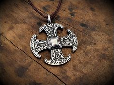 The Canterbury cross, an 8th century Anglo-Saxon brooch, reproduced here as a pendant in lead free pewter or sterling silver. Hand cast, detailed and polished to a silver shine. Measures 4.5cm × 4cm and includes a 1 meter leather cord. Mjolnir Pendant, Coil Ring, Anglo Saxon, Finger Rings, Hand Cast, Cross Pendant Necklace, Canterbury, Leather Cord, Cross Pendant