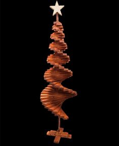 a wooden christmas tree with a star on top