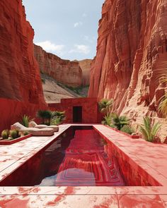 an outdoor swimming pool in the middle of a canyon with red rock formations surrounding it