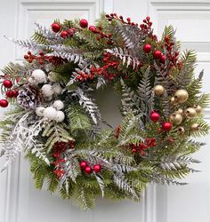 a christmas wreath hanging on the front door