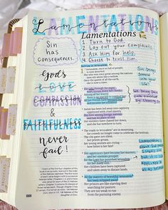 an open bible with handwritten words on it