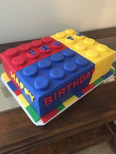 a birthday cake made to look like a lego block