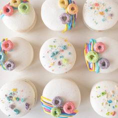 there are many donuts with sprinkles on the top one is white