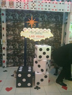 the las vegas welcome sign is surrounded by dice