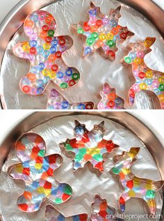 there are many different colored cookies in the pans and one is made out of plastic