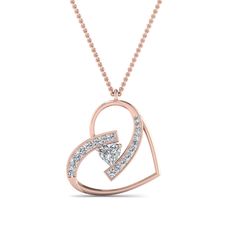 This Diamond Colored Necklace Pendant gracefully presents a mesmerizing heart-shaped stone beautifully augmented by an array of tiny glistening round cut diamonds encased in a classic pave setting on a glossy heart pattern adding a verve of brilliance and elegance to your appearance.  Heart cut center stone of 0.40 ct. and round cut side stones of 0.35 ct. with Clarity SI2 and Color G in a prong and pave setting respectively. This diamond pendant is also available with various other gemstones of your choice in the center. Total Carat Weight:- 0.75 Total Number of Stones:- 19 This diamond heart colored pendant can also be customized with a wide variation of precious metals. Free Shipping Within USA. Direct manufacturing prices. 30 Days Return Policy. Easy Lifetime Upgrade and Fina Colored Necklace, Colored Engagement Rings, Heart Diamond, Heart Shaped Diamond, Heart Pendant Diamond, Heart Gemstone, Pave Setting, Rose Gold Metal, Colourful Necklace