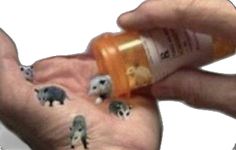 someone is holding out their hand with small animals on it and an empty bottle in the palm