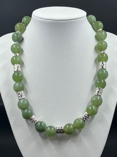 This necklace is made up of 14MM round green gemstone beads with silver accent beads.    This necklace is approximately 18 1/2" long with a toggle closure.  Simple and elegant, handmade unique jewelry. Green And Silver, Green Gemstones, Silver Accents, Gemstone Beads, Beauty Book, Beaded Necklace, Jewelry Necklaces, Accessory Gift, Necklaces