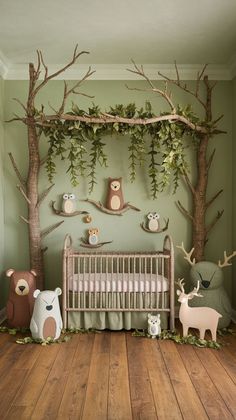 a baby's room with green walls and wooden floors