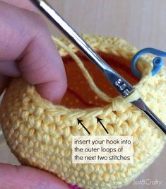 someone is crocheting an object with scissors