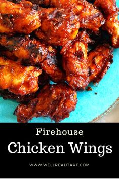 chicken wings on a blue plate with the words firehouse chicken wings above it and below