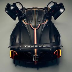 the front end of a black sports car