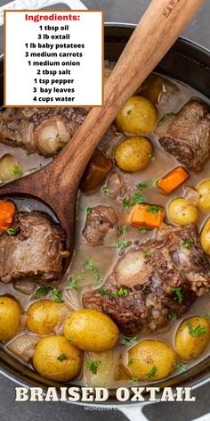 a pot filled with meat and potatoes next to a wooden spoon on top of it