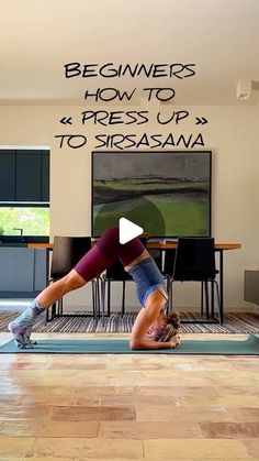 a woman doing a yoga pose in front of a tv