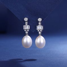 Emulate the elegance of Kate Middleton with our Freshwater Pearl Drop Earrings. Featuring high-luster drop-shaped pearls and sparkling cubic zirconia, each piece is set in 925 sterling silver. Perfect for adding a touch of sophistication and royal charm to any outfit. Product Details: Pearl Type: Freshwater Pearls Pearl Quality: AAAA Pearl Shape: Drop Pearl Size: 9-10mm Materials: 925 Sterling Silver, Cubic Zirconia Style: Elegant, Royal-Inspired These earrings offer timeless elegance ideal for Elegant Pear-shaped Pearl Earrings For Anniversary, Pear-shaped Cubic Zirconia Pearl Earrings For Anniversary, Classic Teardrop Diamond Pearl Earrings, Classic Diamond Teardrop Pearl Earrings, Formal Drop-shape Akoya Pearl Earrings, Formal Teardrop Pearl Earrings With Cubic Zirconia, Luxury Pearl Drop Earrings For Anniversary, Luxury Drop Pearl Earrings For Anniversary, White Gold Teardrop Pearl Earrings With Cubic Zirconia