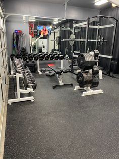 an empty gym with rows of weight machines