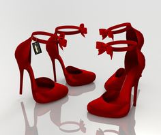 a pair of red high heeled shoes with bows