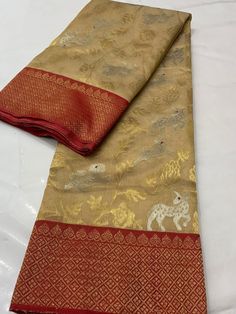 It's a beautiful Original chanderi handloom pure pattu soft silk saree . All over minakari teeli work jaal handmade nakshi border including running plane blouse. Saree length: 6.40m, width: 46in  [ saree 5.50m, blouse 90cm ] Dry clean only . Please note - color may be vary a little due to sunlight and photography . Please message us after purchasing in case you want fall and Pico done it not . No extra charges for fall and Pico but inform us . Blouse stitching is also available . Gold Designer Saree In Traditional Drape, Designer Tissue Silk Saree With Cutdana, Designer Gold Saree With Zari Work, Designer Chanderi Saree Traditional Wear, Designer Tussar Silk Saree For Festive Occasions, Designer Raw Silk Saree With Cutdana, Designer Raw Silk Saree With Zari Work, Designer Saree With Zari Weaving For Festivals, Festive Designer Saree With Zari Weaving