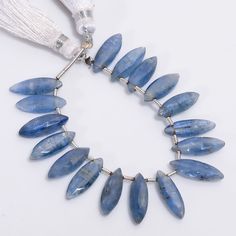 a necklace with blue beads and tassels