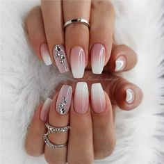 a manicure with white and pink designs on it