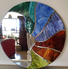 a mirror that is sitting on the wall