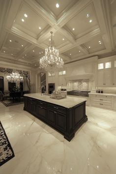 a large kitchen with an island and chandelier