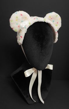 This is an Ice Cream Bear bonnet designed and handmade by me. It is made of a plush ivory fabric with an ivory cotton fabric underside with ivory braid gimp trim. The bonnet is embellished with plush bear ears, handsewn to the base, an ivory satin ribbon butter cream dollop, and hand dotted rainbow funfetti. The piece fastens with an ivory double face satin ribbon that ties into a bow beneath the chin. Crazy Colorful Outfits, Cake Batter Ice Cream, Funfetti Cake, Ivory Fabric, Kawaii Accessories, Kawaii Fashion Outfits, Bear Ears, Head Accessories, J Fashion