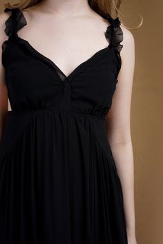 Elevate your style in our Black Chiffon Maxi Dress. The wide V neckline and thick ruffle straps provide an elegant touch, while the side cutouts add a hint of allure. With a high waist fit and relaxed silhouette, this dress offers both comfort and stunning style. Made from 100% polyester, it's perfect for any occasion. Size & Fit Model Measurements (Model is wearing Size S) Bust: 33" Waist: 27" Hips: 37" Height: 5'6" Black Chiffon Maxi Dress, Stunning Style, Tiered Maxi Skirt, Black Chiffon, Chiffon Maxi, Chiffon Maxi Dress, V Neckline, Model Measurements, Gowns Dresses