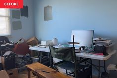 a messy room with blue walls and lots of clutter on the floor, including a desk