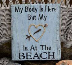 a sign that says, my body is here but my heart is at the beach