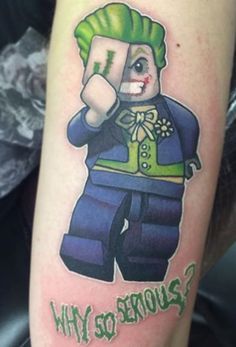 a person with a lego character tattoo on their arm