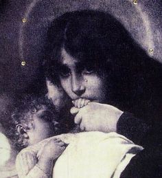 a woman holding a baby in her arms