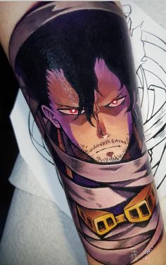 a man's arm with an anime character on it and his eyes are red