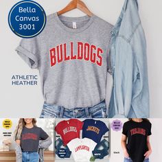 Now available on Comfort Colors Sweatshirts and Long Sleeve. Please click the link below to go there. https://www.etsy.com/listing/1533926095/custom-bulldogs-football-mascot-shirt?click_key=1c62bda2cc9642b6652d956ff07cf41cba280798%3A1533926095&click_sum=d43ade45&ref=shop_home_active_1&pro=1 If you're looking for a team mascot shirt for game day, or any day, consider this one. Thank you for stopping by. Personalization Instructions Please enter the team or mascot name. Please enter the color and Cheap Collegiate Fan Gear Shirt, Affordable Collegiate Shirt For Sports Season, Cheap Gray Tops With Team Name, Cheap T-shirt For Football Season Team Events, Affordable Shirt With Team Name For Game Day, Cheap Team Name Fan Gear Shirt, Cheap Crew Neck Shirt For Team Events, Casual Cheap Fan Gear Shirt, Cheap College Shirt With Team Name