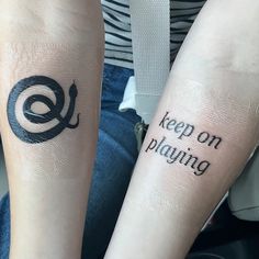 two people with matching tattoos on their arms that say keep on piling and don't