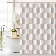 a white tub sitting next to a shower curtain