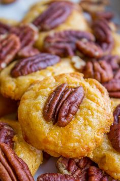 some pecans and cookies are on a plate