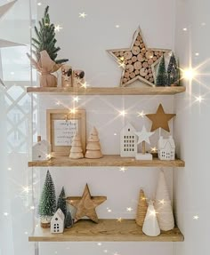 christmas decorations on wooden shelves in a white room