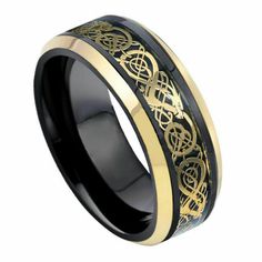 black and gold wedding band with celtic symbols inlayed to the center, on an 18k yellow gold plated ring