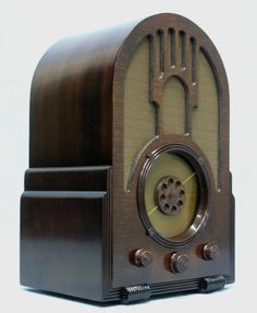 an old fashioned wooden radio on a white background