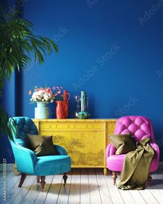 two colorful chairs in front of a yellow dresser and blue wall with potted plants