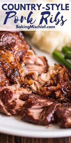 a white plate topped with meat and green beans